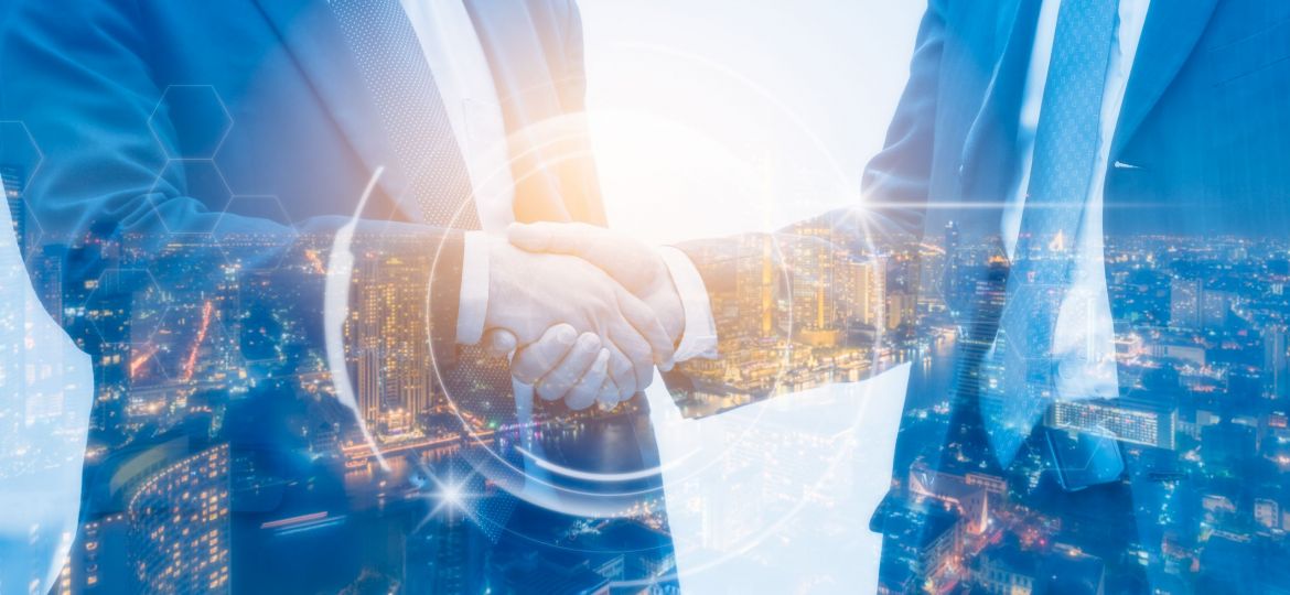 Double exposure of Business people handshake with night city bac